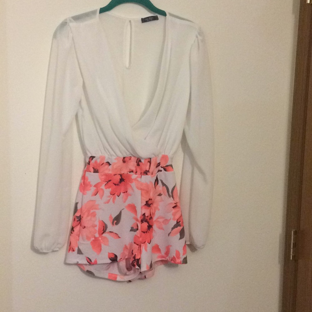 One piece(shorts) white and floral suit.